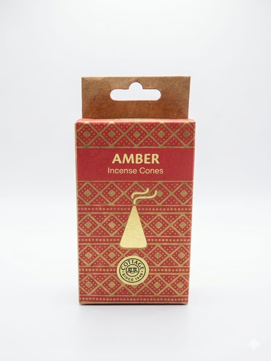 A package of Amber Incense Cones by Sohamna Organics, featuring a red and gold patterned box with a kraft paper hanger tab on a white background.