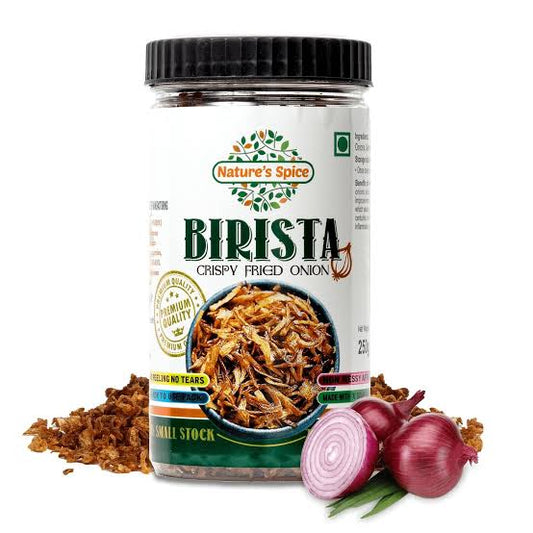 A jar of Sohamna Organics Birista Crispy Fried Onion, shown with loose fried onions and red onions on a white background.