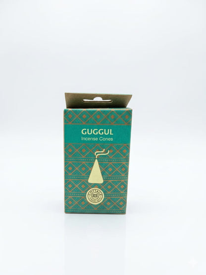 A box of Guggul Incense Cones on a clean white background. The box is teal green with a gold geometric pattern and features a gold incense cone illustration.