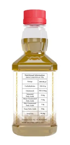 A clear plastic bottle of Moringa oil with a red cap, showing the back label with nutritional information, on a white background.