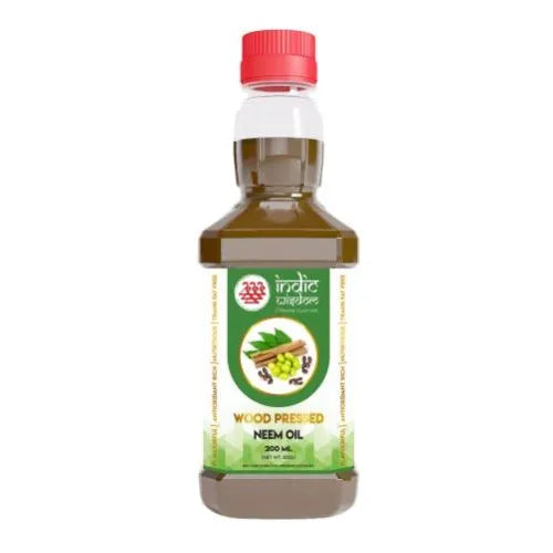 A 200 mL bottle of Wood Pressed Neem Oil with a red cap and green label, shown on a plain white background.