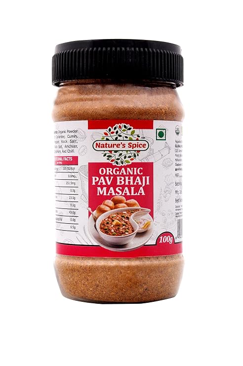 A 100g plastic jar of Sohamna Organics Pav Bhaji Masala, featuring a black lid and a red and white label, set against a plain white background.