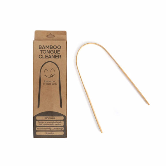 A bamboo tongue cleaner shown next to its brown kraft paper packaging box on a plain white background.