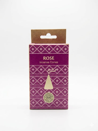 A boxed set of Rose Incense Cones by Sohamna Organics, featuring a purple and magenta geometric patterned box with a kraft paper hanger tab at the top.
